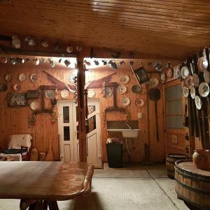 a room with plates and pots and pans on the wall at Recea186 in Recea +3 photos