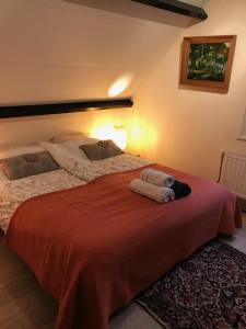 a bedroom with a bed with two towels on it at Maison A La Mer in Retranchement +32 photos