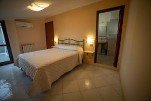 Postel nebo postele na pokoji v ubytování b&b Oikos