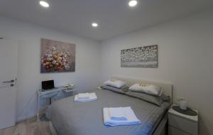 Posteľ alebo postele v izbe v ubytovaní I.P.S. Apartment