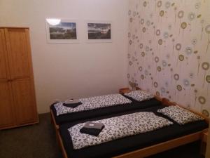 Postel nebo postele na pokoji v ubytování Dům U Šípku