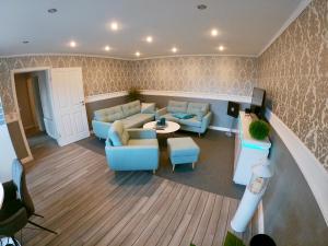 a living room with a couch and a table at Ferienwohnungen Arkonablick Schneidereit in Lohme