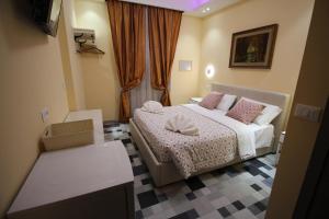 Postel nebo postele na pokoji v ubytování Quest House Lihong