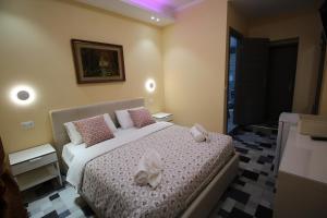Postel nebo postele na pokoji v ubytování Quest House Lihong