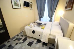 Postel nebo postele na pokoji v ubytování Quest House Lihong