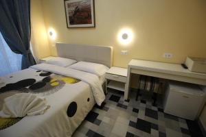 Postel nebo postele na pokoji v ubytování Quest House Lihong