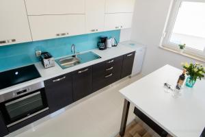 Kuchyň nebo kuchyňský kout v ubytování Apartment AleMar