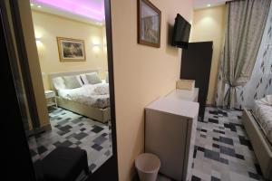 Postel nebo postele na pokoji v ubytování Quest House Lihong