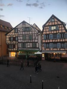 a group of people walking in front of a building at Studio Grand Rue in Colmar