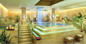 a lobby with stairs and a swimming pool at Nobu Las Vegas, A Caesars Destination in Las Vegas