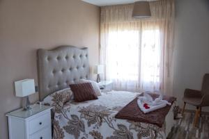 Postel nebo postele na pokoji v ubytování Villa Castro