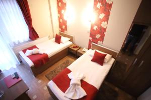 Voodi või voodid majutusasutuse Garni Hotel Laguna Lux toas