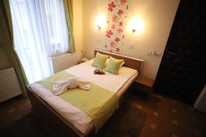 Voodi või voodid majutusasutuse Garni Hotel Laguna Lux toas