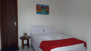 Tempat tidur dalam kamar di Villa Portal dos Ventos