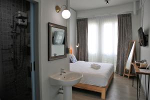 Postel nebo postele na pokoji v ubytování Latima Boutique Hostel