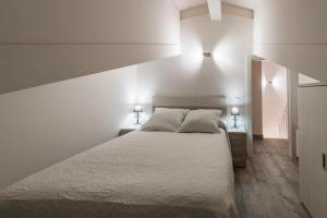 Posteľ alebo postele v izbe v ubytovaní Apartamentos Turísticos el Pontón
