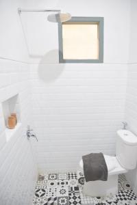 Kylpyhuone majoituspaikassa Grhatama Guest House