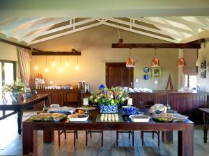 a dining room with a table with food on it at 2 Owls Guesthouse in Potchefstroom +79 photos
