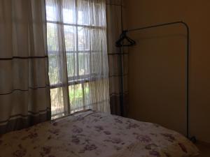 Postel nebo postele na pokoji v ubytování ADA Homestay
