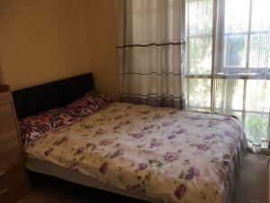 Postel nebo postele na pokoji v ubytování ADA Homestay