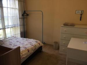 Postel nebo postele na pokoji v ubytování ADA Homestay