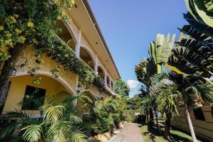 a building with plants on the side of it at Turtle Bay Dive Resort in Moalboal