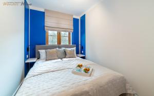 Posteľ alebo postele v izbe v ubytovaní Wonder Home - Apartamenty w zielonej okolicy, blisko centrum Karpacza