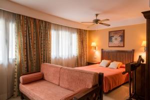 Postel nebo postele na pokoji v ubytování Aparthotel El Galeón