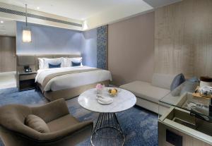 Letto o letti in una camera di Caesar Park Hotel Banqiao