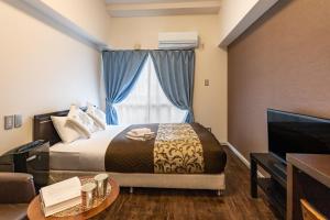 Cama o camas de una habitación en Mr Kinjo Eminence Inn Maejima