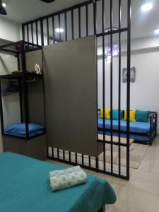 a room with two bunk beds and a partition at Imara Apartment D' Perdana in Kota Bharu
