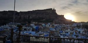 a city with a castle on top of a hill at Castle View Home stay in Jodhpur
