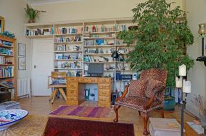 a living room with a desk and a chair at Fab Brunswick by the sea in Brighton & Hove