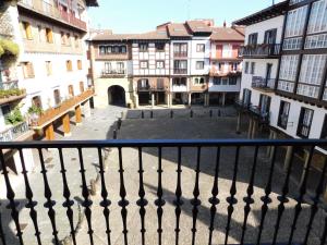 a view from a balcony of a city with buildings at Hotel Palacete in Hondarribia