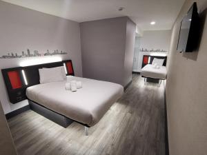 Postel nebo postele na pokoji v ubytování easyHotel Leeds + 37 fotografií