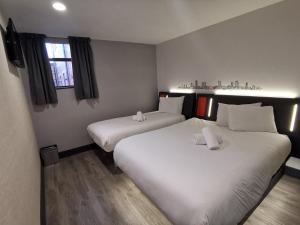 Vuode tai vuoteita majoituspaikassa easyHotel Leeds