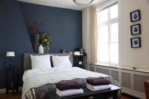 Postel nebo postele na pokoji v ubytování Boutique B&B de PASTORY