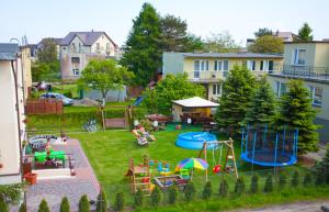 an aerial view of a backyard with a playground at Willa Apollo in Władysławowo