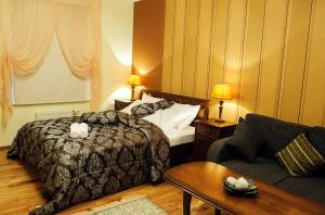 Voodi või voodid majutusasutuse Embrace Hotel & Apartments toas