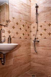 a bathroom with a sink and a shower at New Star Residence in Burgas City +20 photos