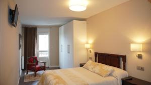 Postel nebo postele na pokoji v ubytování Apartamento Vía Romana XIX
