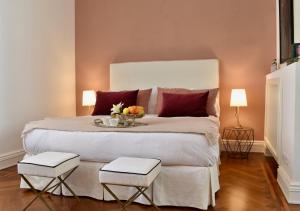 Säng eller sängar i ett rum på Palazzina Mori - Luxury B&B