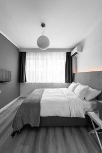 Postel nebo postele na pokoji v ubytování M&F Luxury Suites M Suite
