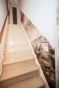 a stairwell with a mural of a ship at Silver Suite in Venice