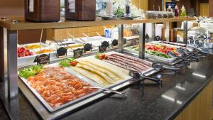 a buffet line with many different types of food at Hestia Hotel Europa in Tallinn