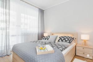 Posteľ alebo postele v izbe v ubytovaní Jantar Apartamenty Bliżej Morza