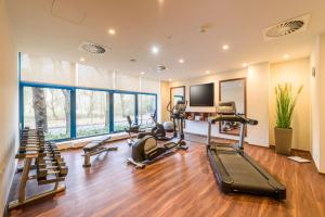 a gym with treadmills and cardio equipment in a room at Maritim Hotel Bremen in Bremen +77 photos