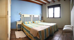 Кровать или кровати в номере Casa SOPALACIO