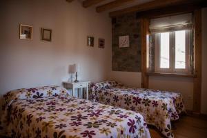 Posteľ alebo postele v izbe v ubytovaní La Casa de Santa Olalla