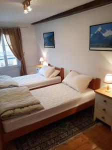 Een bed of bedden in een kamer bij Quai Peree Apartement